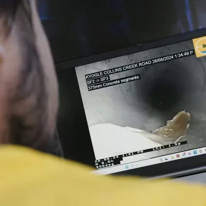 Operator reviewing an internal pipe inspection on a CCTV monitor